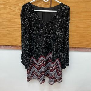 black and white polka dot dress with red zig zag lines and long sleeves & v neck